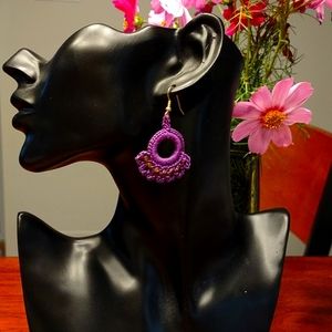Handcrafted crocheted chandelier earrings in purple with gold beading
